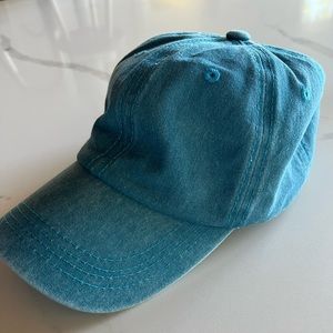 Brand new , never worn but cut tag. Distressed blue womens baseball cap!
